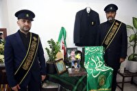 پرچم متبرک حرم مطهر درمنزل شهدای دفاع مقدس 12 روزه